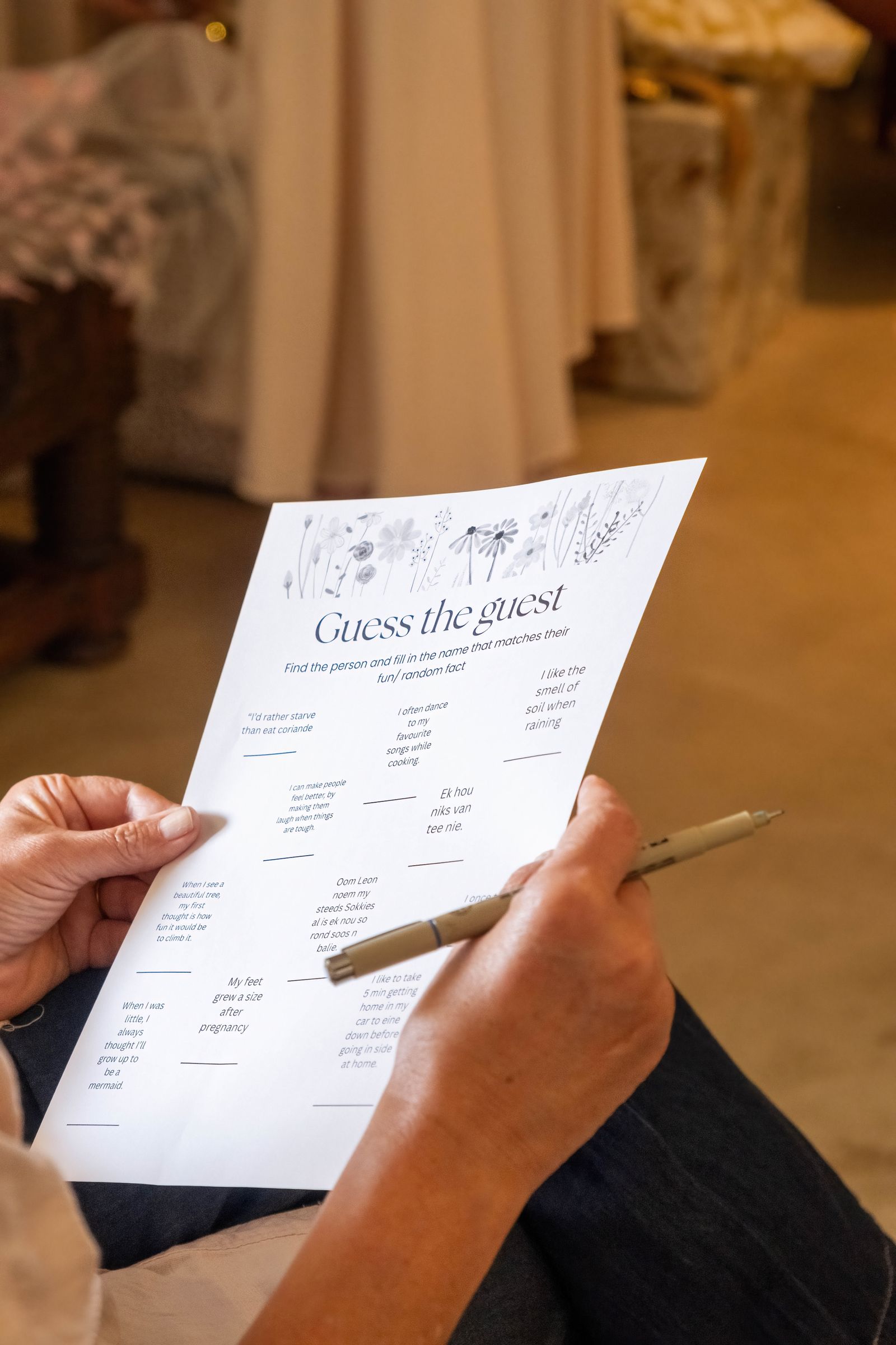 Guest filling out a game night answer sheet